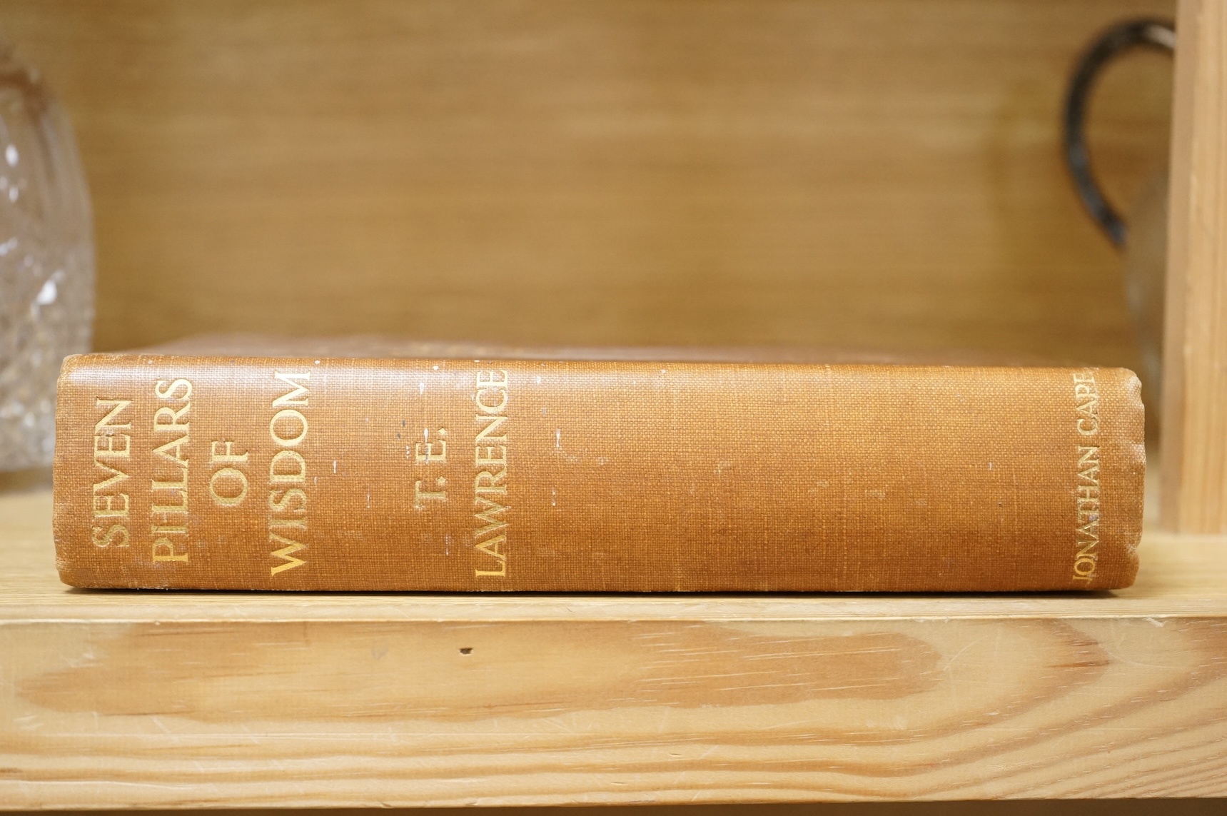 Lawrence, T.E. - Seven Pillars of Wisdom: a triumph. First Trade Edition. portrait frontis., num. portrait plates, 4 folded maps (outline colour) and some text illus.; original gilt cloth, roy. 8vo. 1935.